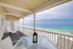 Enjoy dining out on the spacious balcony with beautiful beach views.
